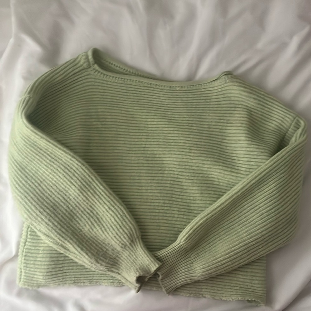 light green sweater from a thrift shop